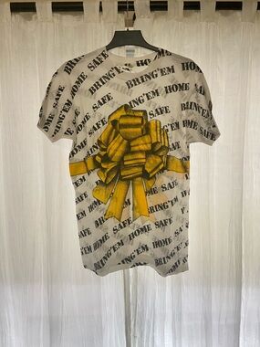 Vintage Screen Stars AOP “Bring’Em Home Safe” White Tee with Yellow Bow Graphic